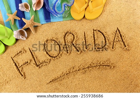 Florida beach : word written in sand.