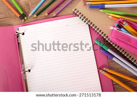 Blank writing book, student desk, pencil, top view
