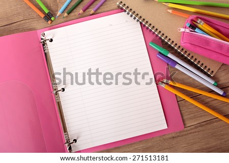 Blank writing book ring binder, student desk, top view