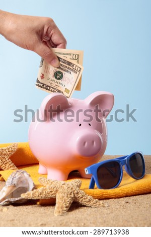 Saving for vacation, travel money or retirement, piggy bank, beach.