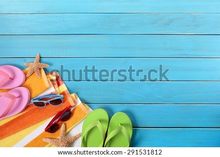 Summer border, beach background, sunglasses, blue wood deck, copy space