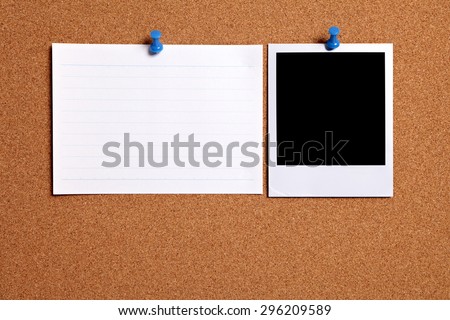 Polaroid photo print, office index card, cork board.  Copy space.