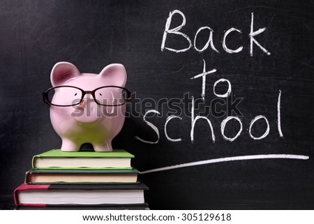 Back to school message memo reminder, chalk blackboard, piggy bank, education costs and saving concept