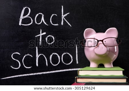 Back to school message reminder, classroom blackboard, piggy bank