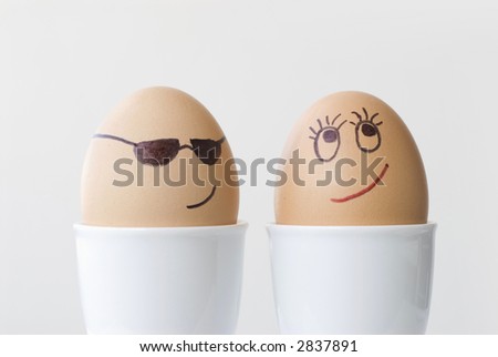 Eggs boiled, eggcup.  Smiley face, love, dating concept.