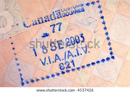 Canada customs immigration entry stamp on the inside page of a passport.