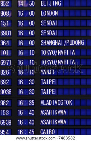 Airport departures and arrivals board with various destinations