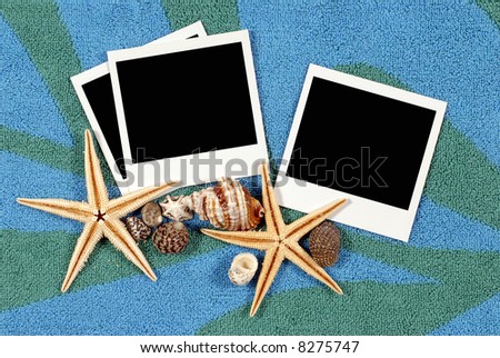 Beach background with beach towel, starfish, shells and blank polaroid prints