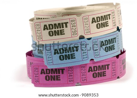 Ticket roll : Rolls of blue, pink and white admit one movie or theater tickets isolated on white background.