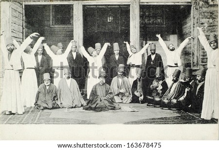 Istanbul, Turkey - Circa 1900\'S :Mevlevi Sufi Dervishes. Mevlevi Dervish Also Known As Whirling Dervish(A Spiritual Sect Following Rumi\'S Way) Saluting Traditionally