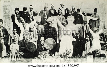 ISTANBUL, TURKEY - CIRCA 1900\'s :Mevlevi Sufi Dervishes. Mevlevi dervish also known as Whirling Dervish(a spiritual sect following Rumi\'s way) saluting traditionally