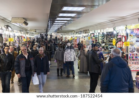 ISTANBUL, TURKEY - APRIL 06, 2014: People pass their time on a underpass in Istanbul\'s Eminonu quarter on April 06, 2014 in Istanbul, Turkey.People and tourists visit and shopping in Eminonu District