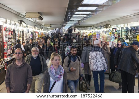 ISTANBUL, TURKEY - APRIL 06, 2014: People pass their time on a underpass in Istanbul\'s Eminonu quarter on April 06, 2014 in Istanbul, Turkey.People and tourists visit and shopping in Eminonu District