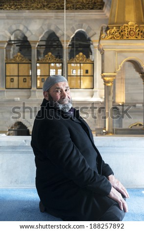 ISTANBUL - MARCH 14,2014: Turkish Muslim man with beard portrait. Portrait of muslim man praying in Nusretiye Mosque ,istanbul.