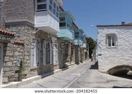 ALACATI, TURKEY -JULY 07, 2014:Alacati, well known for its architecture, vineyards and windmills is a popular summer tourist destination.