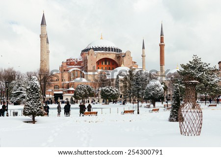 ISTANBUL, TURKEY - FEBRUARY 18, 2015:istanbul winter a day. St. Sophia Cathedral while snowing.People walking in Sultanahmet District under snow.
