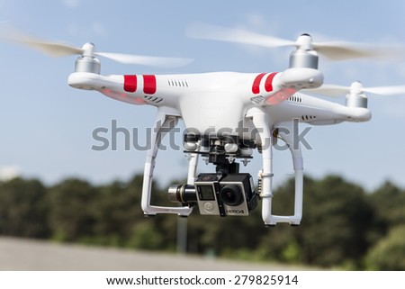ISTANBUL, TURKEY - MAY 19 ,2015: Flying drone quadcopter Dji Phantom 2 with digital camera GoPro HERO4.