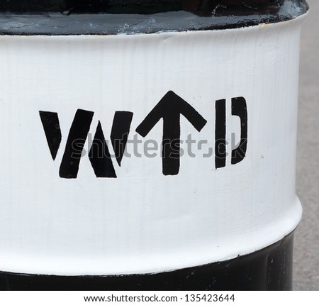 War Department sign on an oil drum
