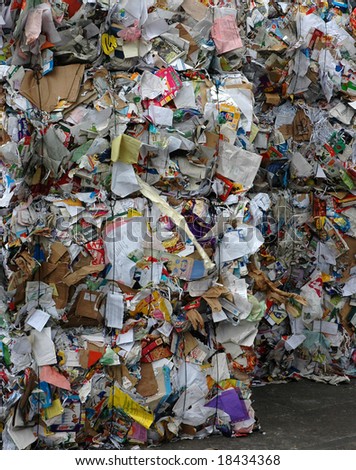 Stack of paper waiting to be recycled at recycling plant