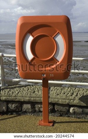 A red lifesaving belt on the sea front