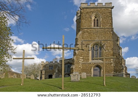 An English Parish Church with 3 crosses outside at Easter time
