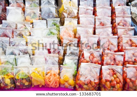 Dry preserved fruit in plastic bag.