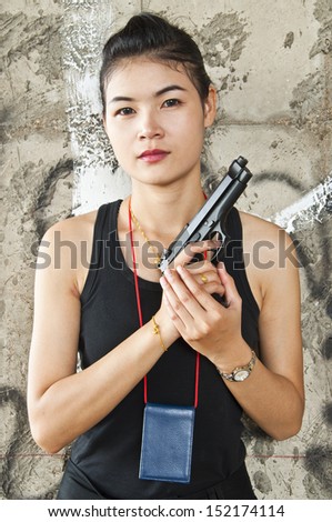 Beautiful Asian policewoman in action.