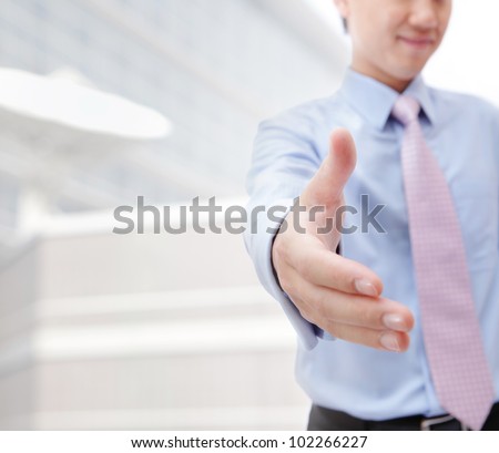 Close up of business people shaking hands over a deal at office - Indoors, model is a asian man