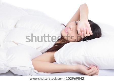 young woman sleep on bed at home in the morning, model is a asian girl
