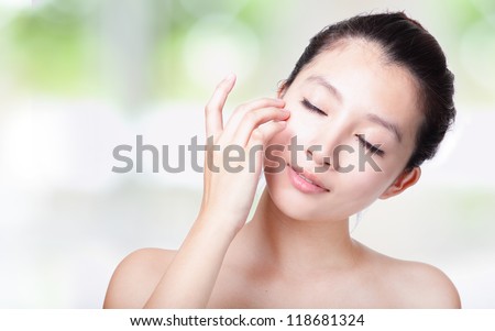 Close Up Of Woman Relax Touch Her Closed Eyes And Face With Smile, Concept For Eyes Care Or Skin Care, With Nature Green Background, Model Is A Asian Girl