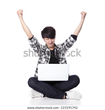 Young student Man with laptop and sitting on floor and excited raise his arms in full length isolated on white background, asian model