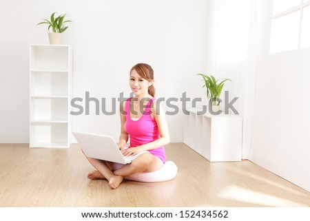Young beautiful girl with a laptop at home , asian beauty model