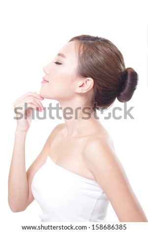Beautiful woman cares for the skin, posing at studio isolated on white background, asian beauty model
