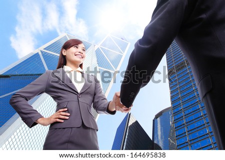 Business Woman And Man Handshake With Business Office Building Background, Asian, Hong Kong