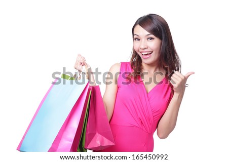 happy shopping young woman show thumb up with bags - isolated on white background, asian model