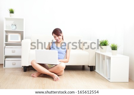 Woman Using Laptop On Sofa In The Living Room, Asian Beauty
