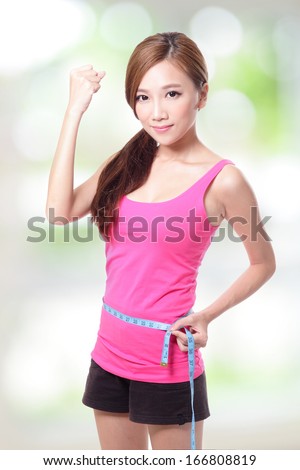 sporty woman shapes and measure on green background, asian