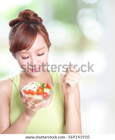 Portrait Of Attractive Woman Smile Eating Salad Isolated On Green Background, Asian Beauty Model