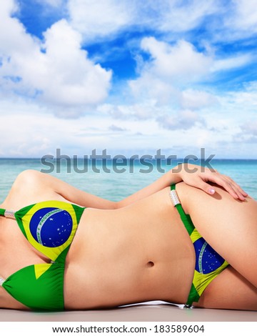http://image.shutterstock.com/display_pic_with_logo/870799/183589604/stock-photo-young-woman-wearing-brazil-bikini-swimsuit-sunbathing-at-sea-beach-183589604.jpg