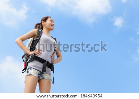 happy woman mountain hiker with backpack looking to sky, asian