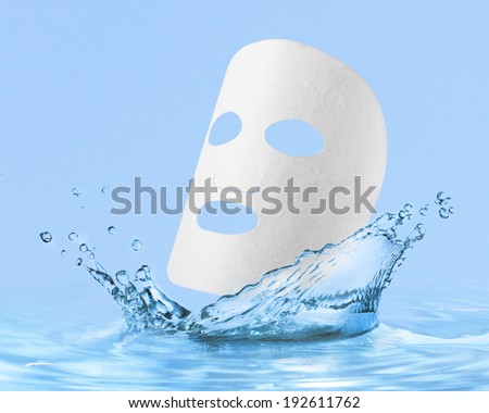 cloth facial mask with water drop, isolated over blue background