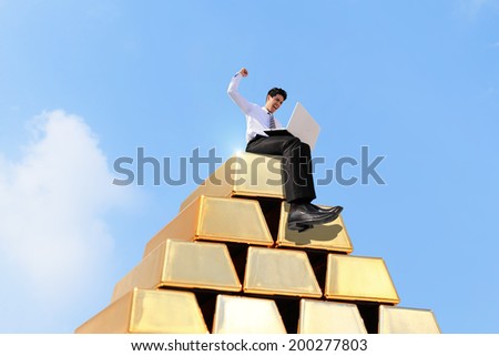 Successful business man working on growth money stairs coin with sky