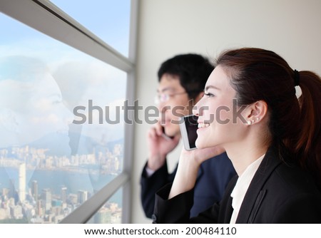 Smile Business team speaking phone and looking through window with city background, asia, hong kong, asian