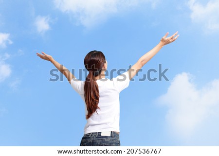 Happiness freedom concept. Woman happy smiling with arms up, asian beauty