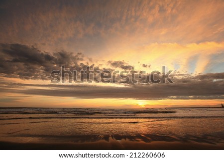 Soft Sea Ocean Waves Wash Over Golden Sand Background. Sunset, Sunrise, Sun.