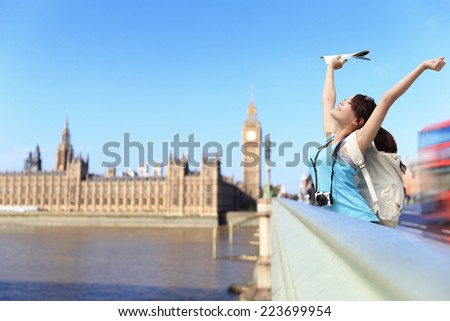Happy woman traveler relax feel free in London with Big Ben tower,  London, UK, asian beauty