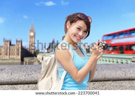 Happy woman traveler take photo selfie by camera in London with Big Ben tower,  London, UK,  asian beauty