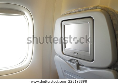 White LCD screen in an airplane seat, copy space for text or image