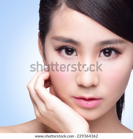 Beautiful Skin care woman isolated on blue background. asian Beauty