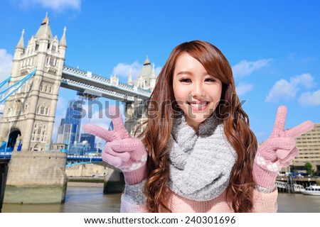 Happy woman travel in london with Tower Bridge in United Kingdom, uk